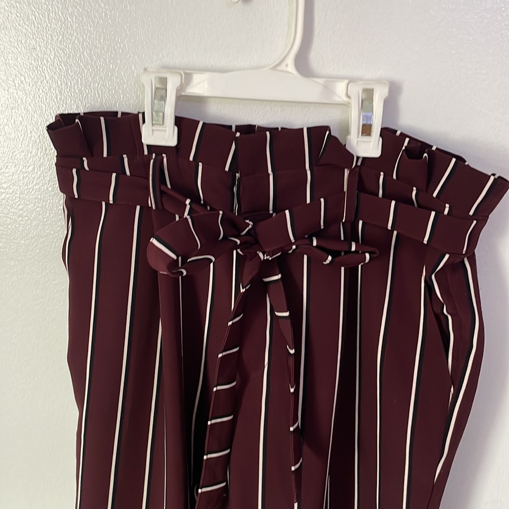 Maroon with long black and white stripes and an adjustable built in tie belt